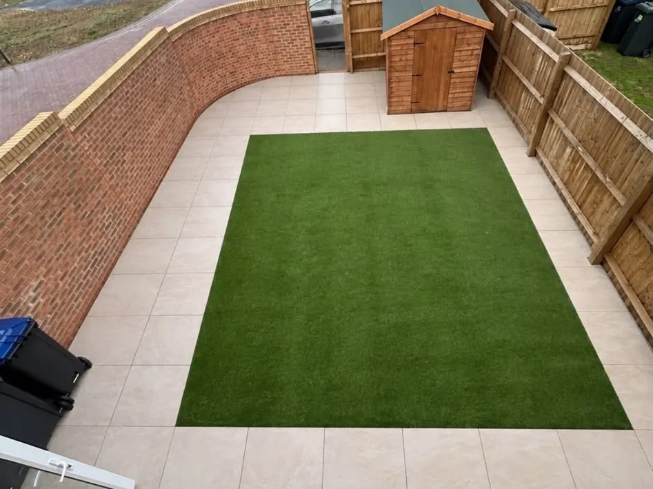 Patio, artificial grass and garden wall after work