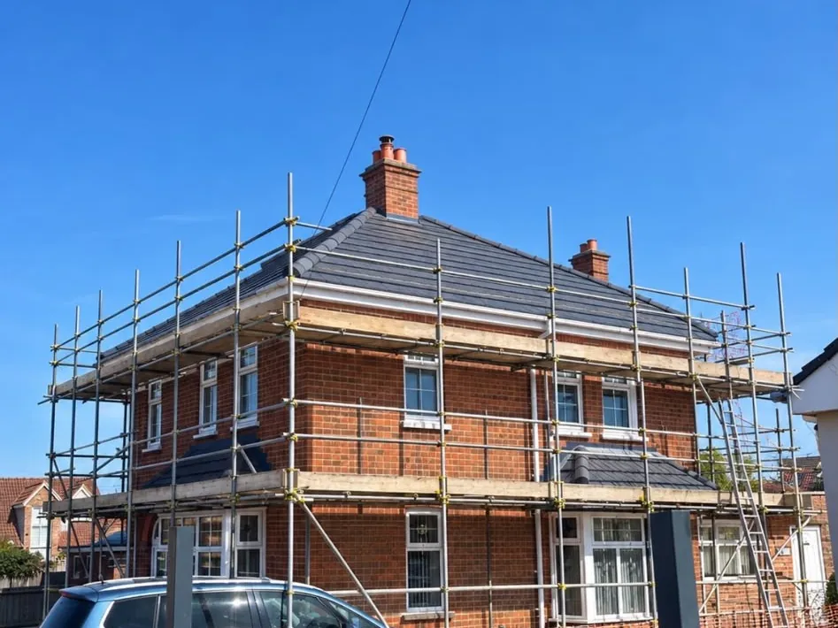 Re-roofing work under scaffolding